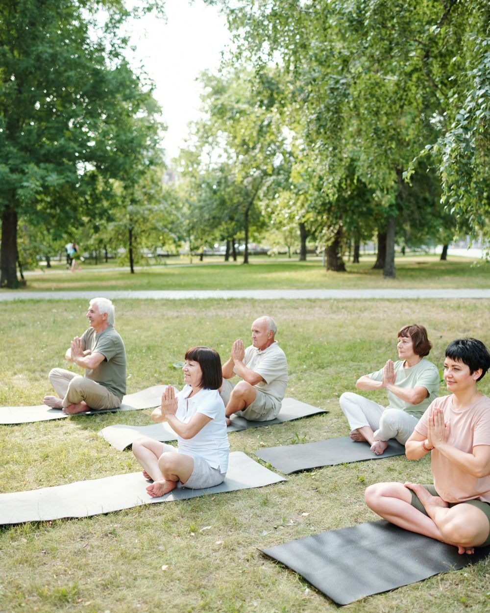 People meditating outdoors